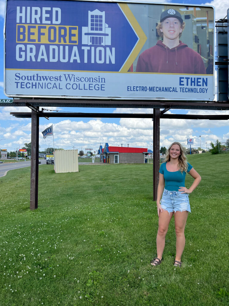 Olivia Next to billboard